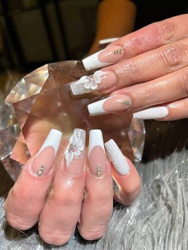 French tip nail design with floral details